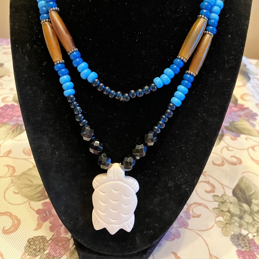 CARVED BONE TURTLE ON GLASS AND WOODEN BEAD NECKLACE